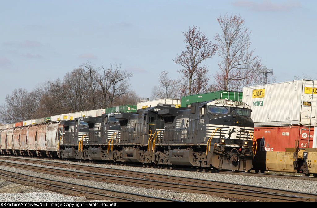 NS 9954 leads train 128 past train 214